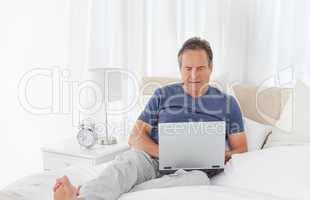 Man looking at his laptop