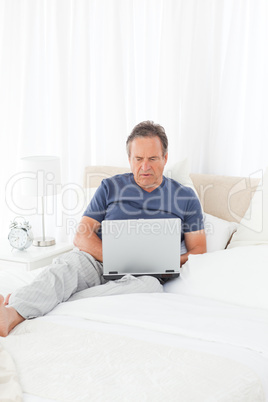 Man looking at his laptop