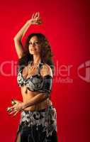 Beauty woman belly dance with finger cymbals