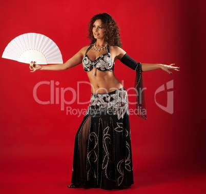 Woman belly dance with fan