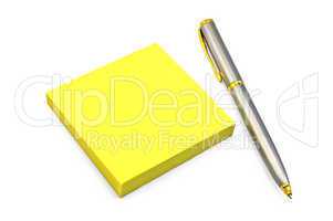 Yellow paper with a silver pen