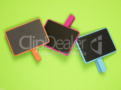 Colorful blackboards on green background