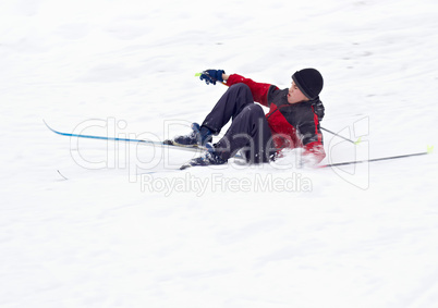 Boy Skier fell on snow