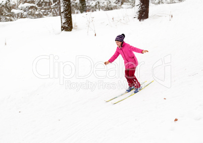 Bright girl Skiing