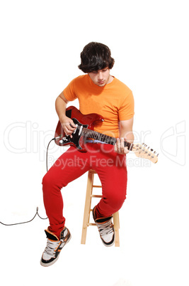 Teen boy with guitar.