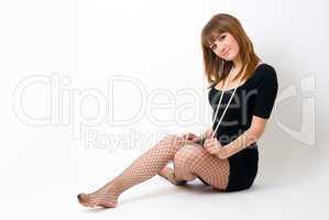 Beautiful red-haired girl with beads