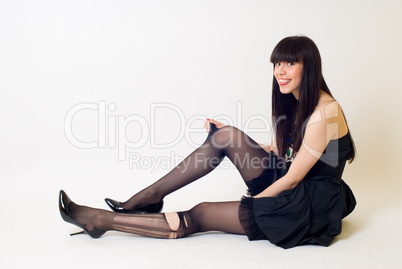 Young woman in torn stockings