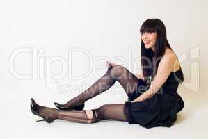 Young woman in torn stockings