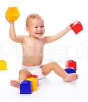 Happy little boy with building bricks