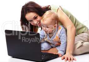 Mother an her son are playing with laptop