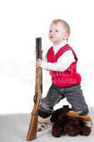 Little boy playing with gun