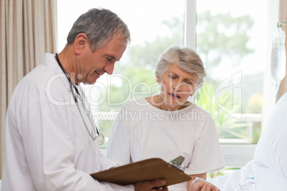 Mature doctor with his patient