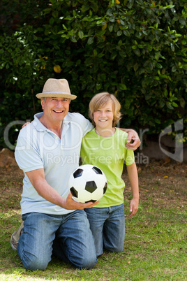 Grandfather and his grandson looking at the camera