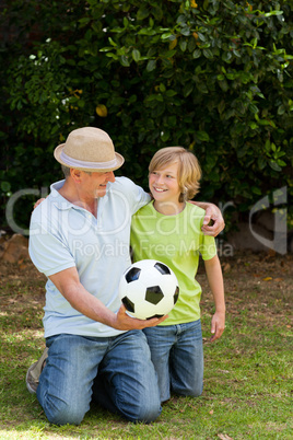 Grandfather and his grandson looking at the camera