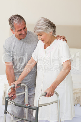 Mature man helping his wife