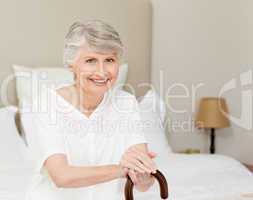 Retired woman with her walking stick
