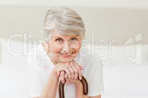 Retired woman with her walking stick