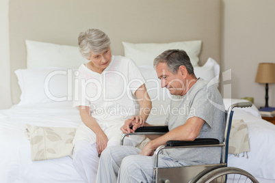 Mature couple in their bedroom