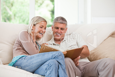 Couple looking at their photo album