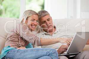 Couple looking at their laptop