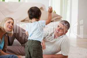 Son playing with his parents