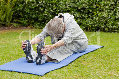 Senior woman doing her streches