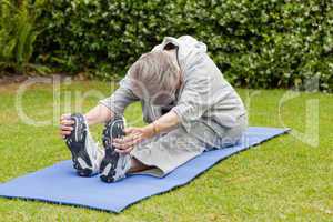 Senior woman doing her streches