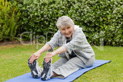 Senior woman doing her streches