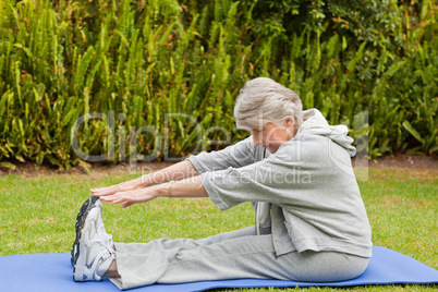 Senior woman doing her streches