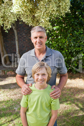 Boy with his Grandfather looking at the camera