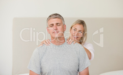 Woman giving a massage to her husband