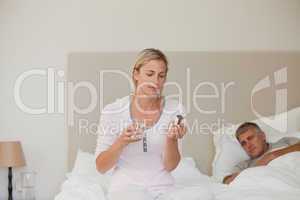 Woman taking pills at home