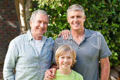 Family looking at the camera in the garden