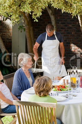 Family eating in the garden