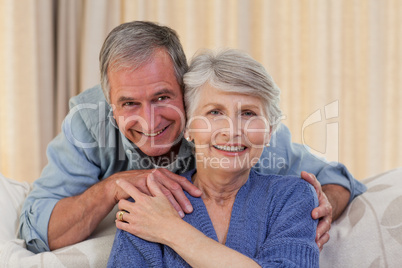 Mature man hugging his wife