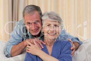 Mature man hugging his wife