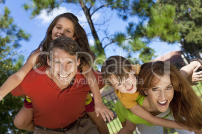 Happy Family Having Fun Outside In Park