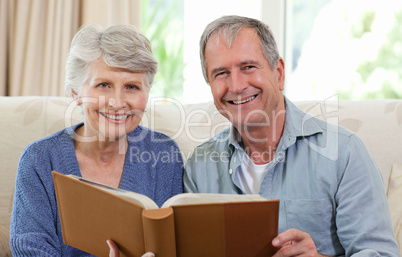 Seniors looking at their photo album