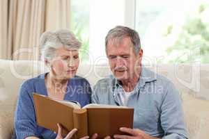 Seniors looking at their photo album