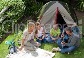 Happy family camping in the garden
