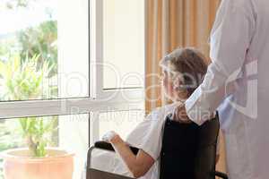 Doctor with his patient looking out the window