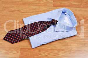 Blue dress shirt with tie.