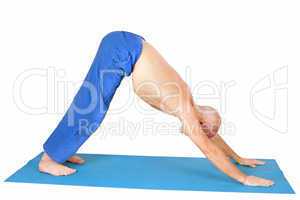 Yoga. Man in  Adho Mukha Svanasana position