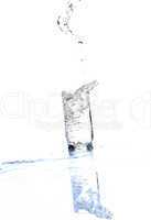 Water streaming from bottle isolated on white
