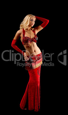 Young blond girl in dance - red arabian costume