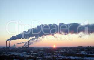 winter industrial sunset with smoke