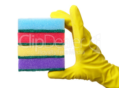 Hand holding a pile of washing sponges