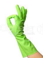 Hand wearing rubber glove shows OK sign