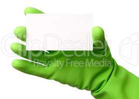Hand in green glove showing business card