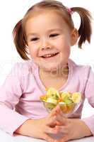 Little girl with fruit salad